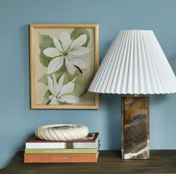 Framed botanical print beside a lamp